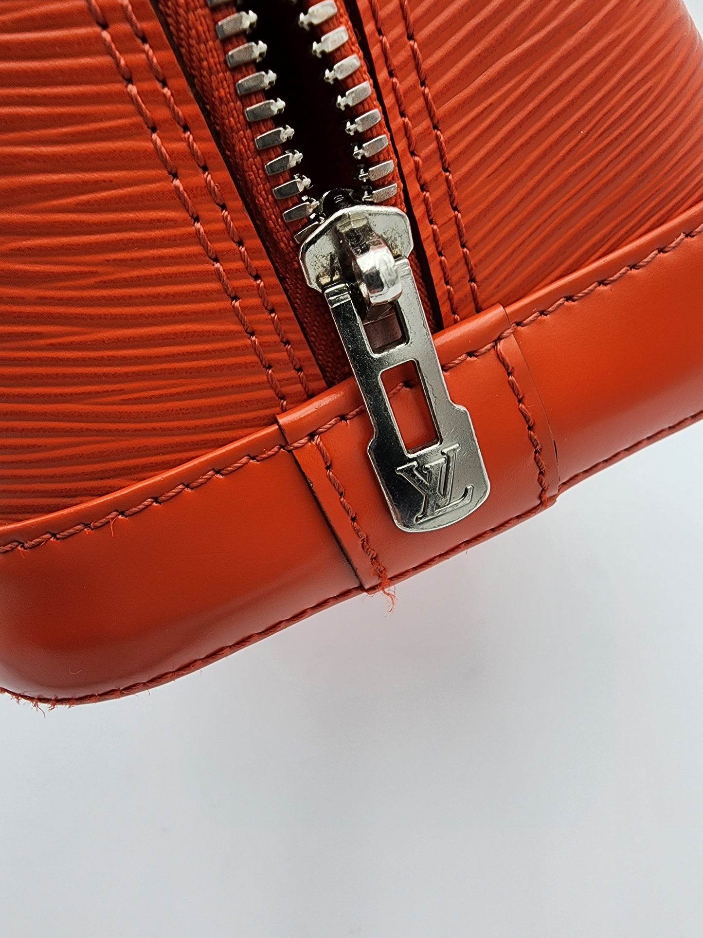 Louis Vuitton Alma PM Handbag In Piment Epi Leather