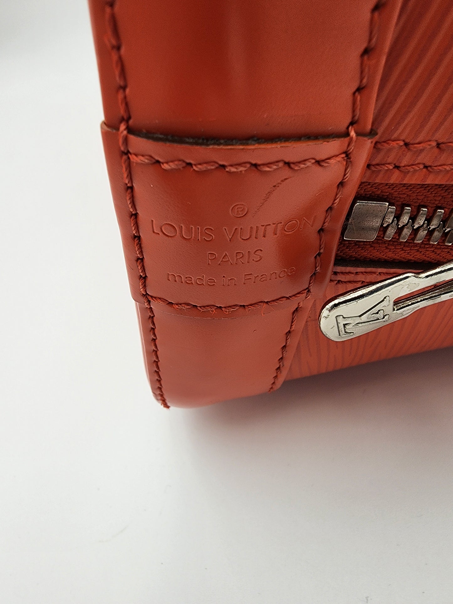 Louis Vuitton Alma PM Handbag In Piment Epi Leather