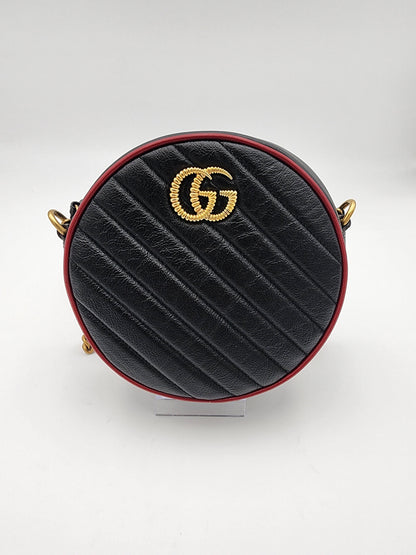 Gucci GG Marmont Mini Round Shoulder Bag In Black Matelasse Calfskin Leather With Red Piping