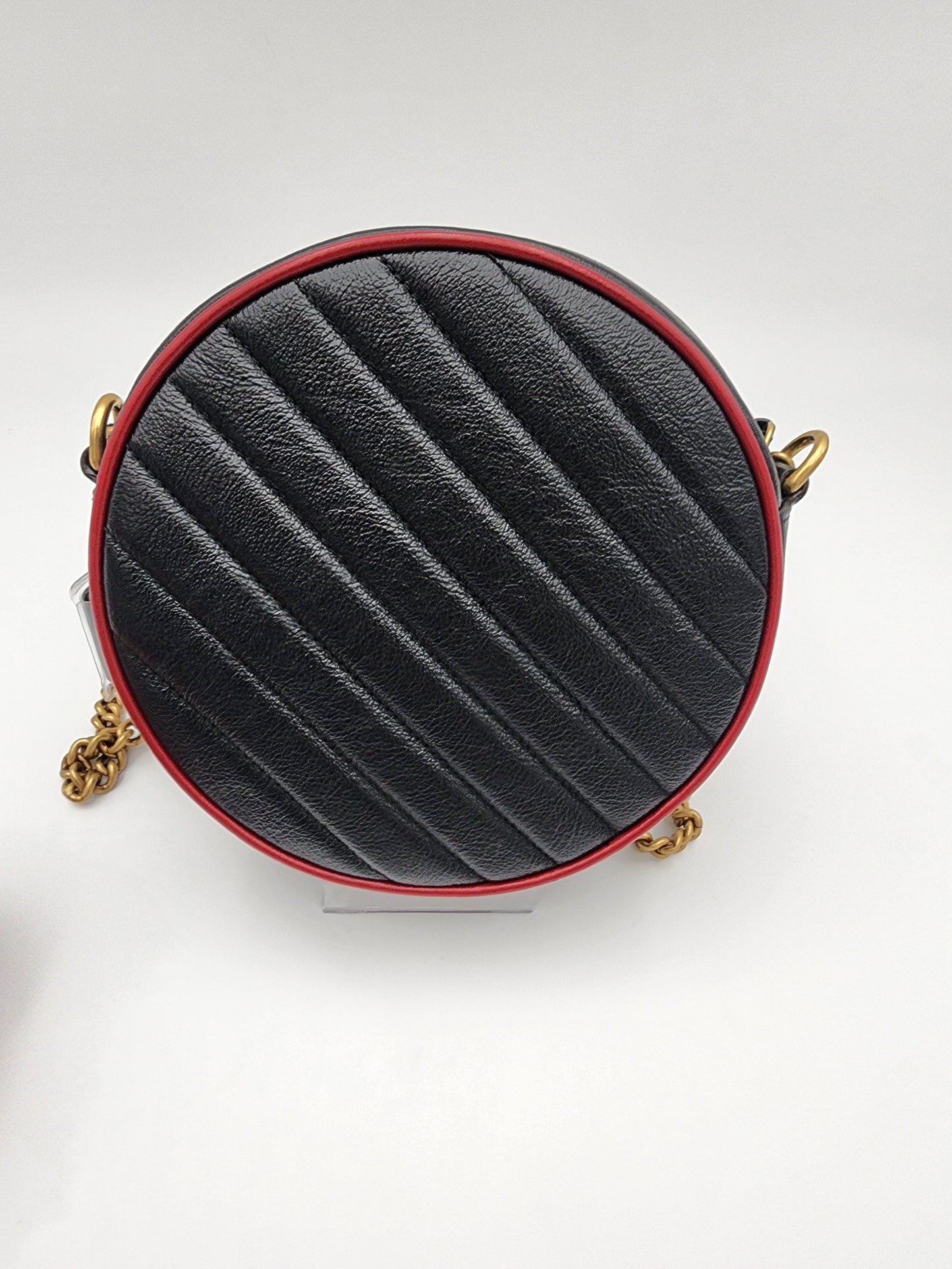 Gucci GG Marmont Mini Round Shoulder Bag In Black Matelasse Calfskin Leather With Red Piping