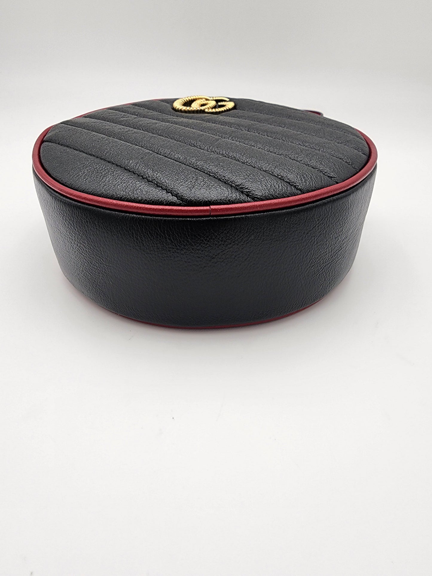 Gucci GG Marmont Mini Round Shoulder Bag In Black Matelasse Calfskin Leather With Red Piping