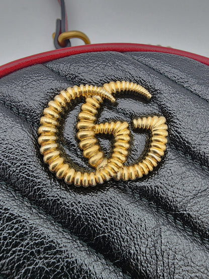 Gucci GG Marmont Mini Round Shoulder Bag In Black Matelasse Calfskin Leather With Red Piping