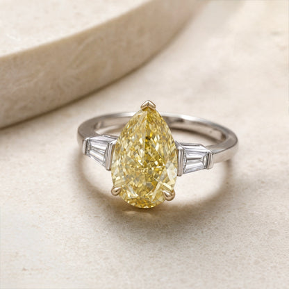 JANARY Pear Modified Brilliant 7.07-Carat Fancy Vivid Yellow Diamond Ring in 18K White Gold