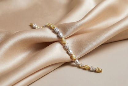 JANARY 8-Carat Pear White & Fancy Yellow Diamond Alternative Tennis Bracelet in 18K Gold