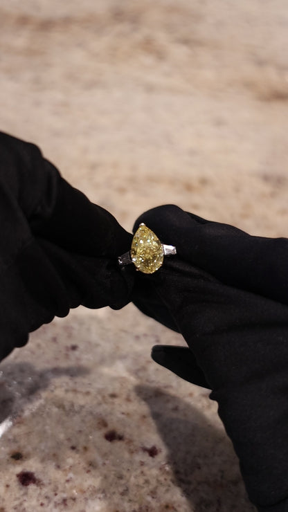 JANARY Pear Modified Brilliant 7.07-Carat Fancy Vivid Yellow Diamond Ring in 18K White Gold