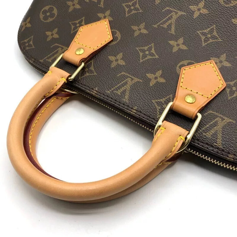 LOUIS VUITTON Alma Handbag