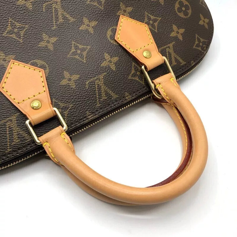 LOUIS VUITTON Alma Handbag