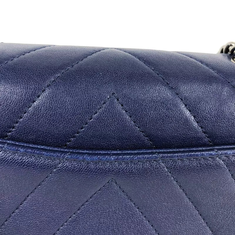 CHANEL Mini Chevron Shoulder Bag In Navy Lambskin with Silver Hardware